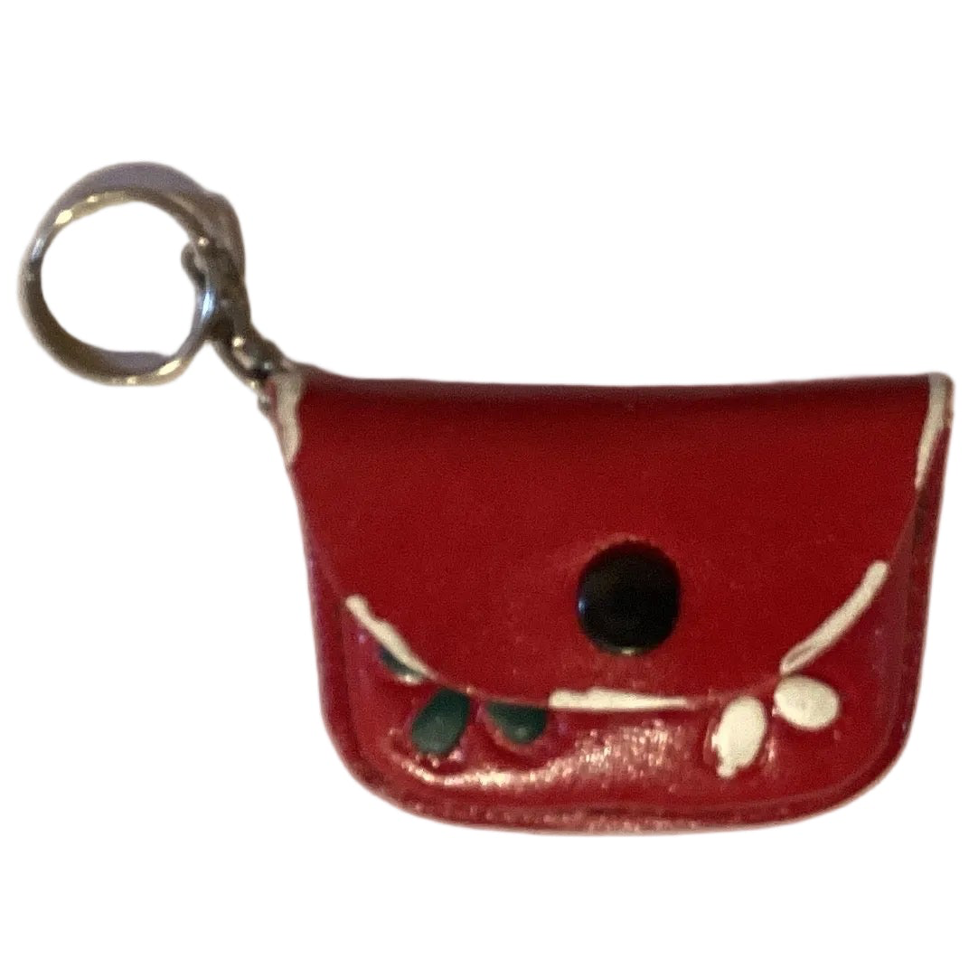 Mini leather coin purse and keychain with Western style design from Ysleta Mission Gift Shop, featuring El Paso-themed accessories.
