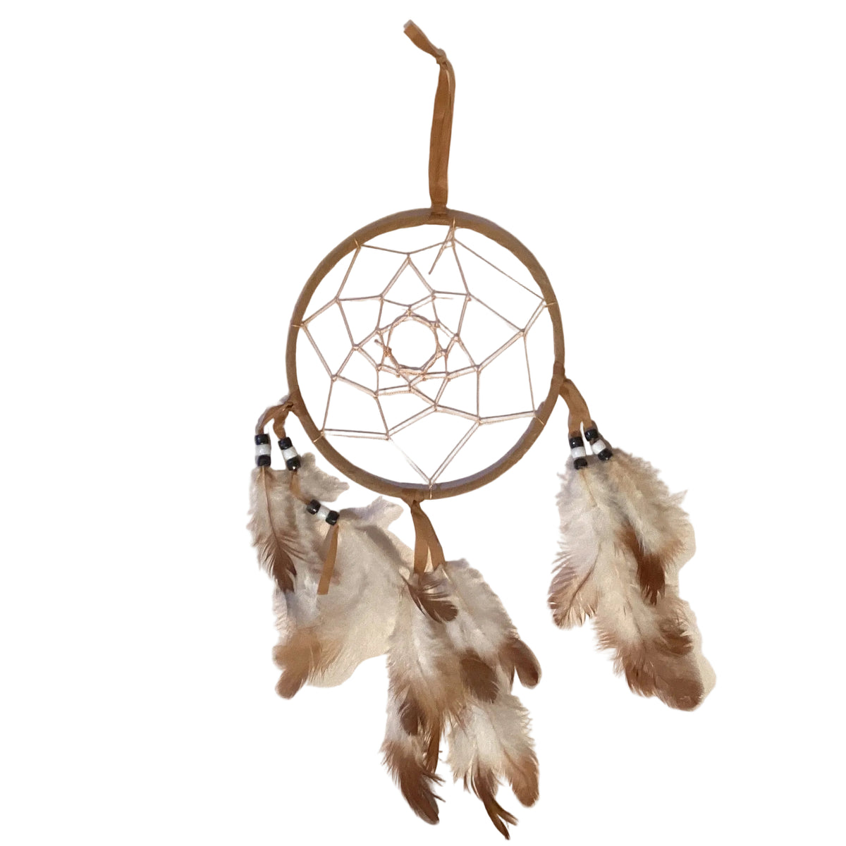 Earth-tone dreamcatchers hanging on a wall, handcrafted wall art from Ysleta Mission Gift Shop for home and garden decor.