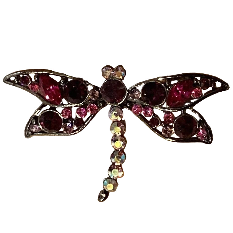 Pink gemstone dragonfly brooch with intricate details, Catholic Christian jewelry, symbol of faith and beauty.