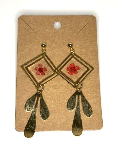 Gold geometric dangling earrings with pressed flower details by Melissa Cortinas, showcasing intricate design and elegant craftsmanship.