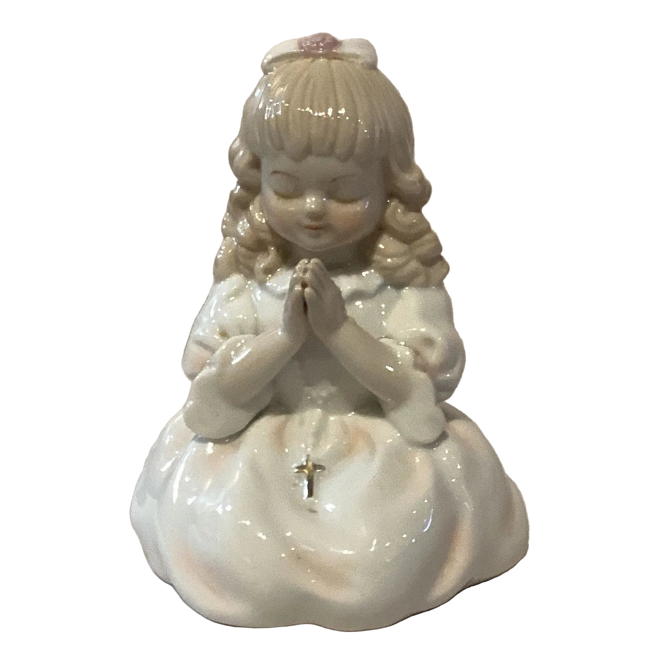 Porcelain praying girl figurine from Ysleta Mission Gift Shop, showcasing a delicate girl with hands clasped in prayer.