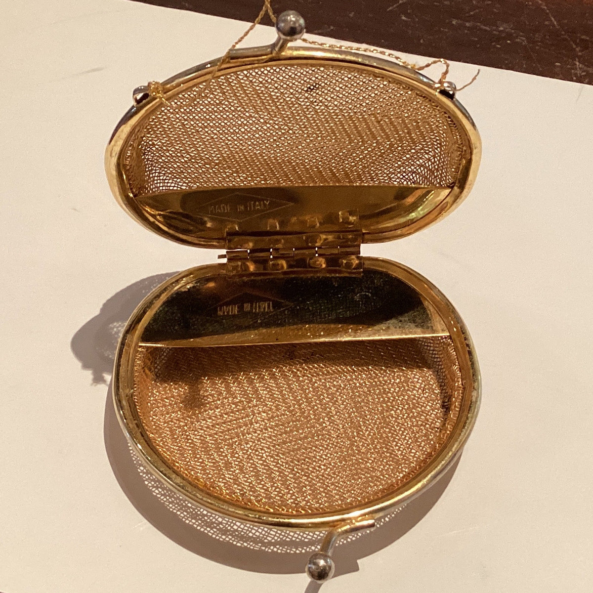 Gold-tone mesh coin purse with vintage design, 3-inch size, made in Italy, perfect for collectible home and garden decor.