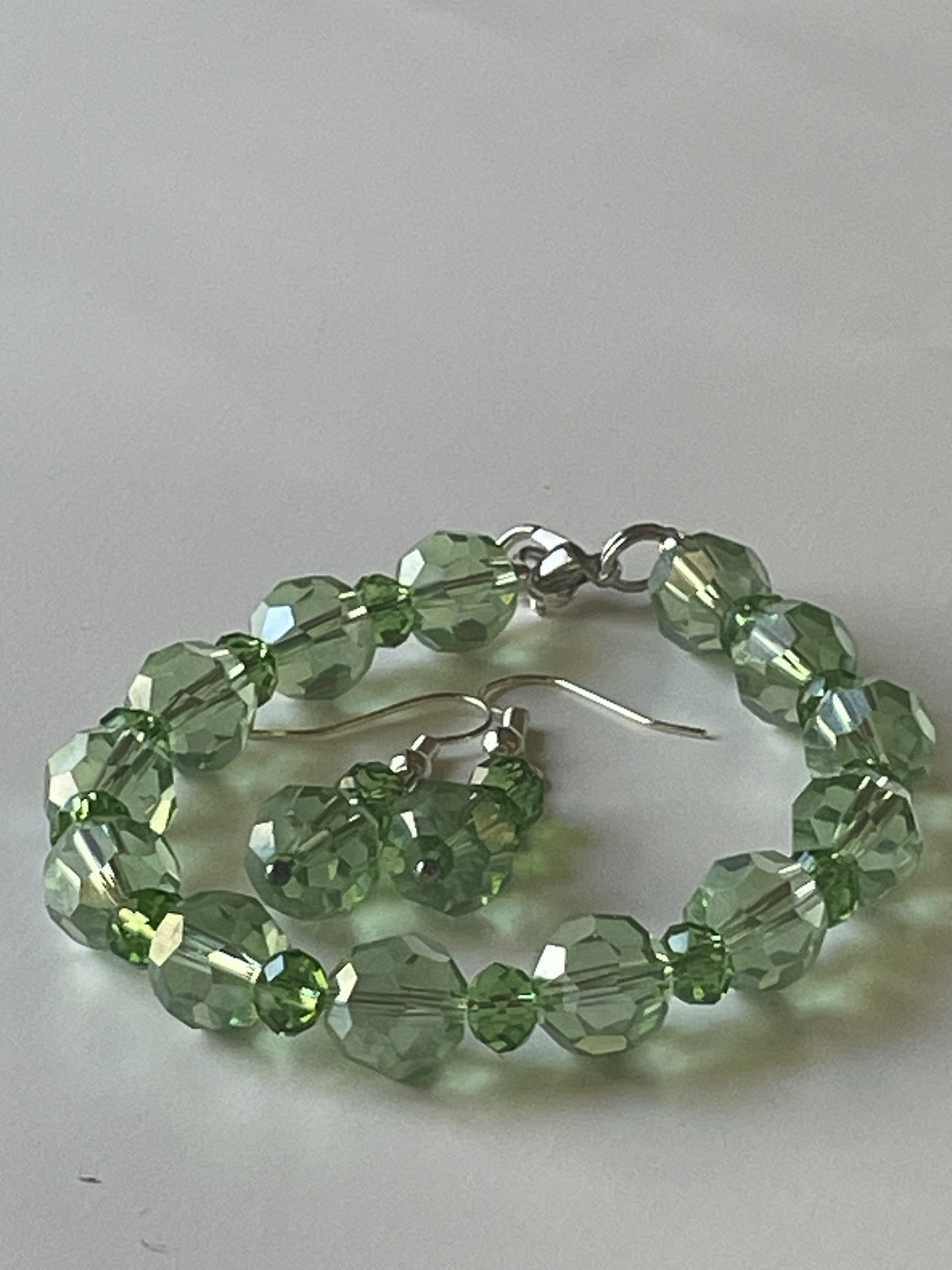 7-inch green dragon vein agate bracelet with matching dangle earrings, glass beads, silver clasp, and earring hooks by Sylvia Leroux