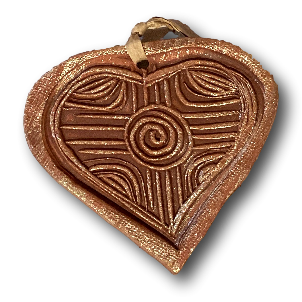 Handmade clay 4-inch decorative ornaments with colorful designs, perfect for home and garden decor from Ysleta Mission Gift Shop.
