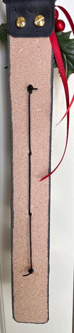 Black leather bell hanger with gold Christmas bells and holiday decor