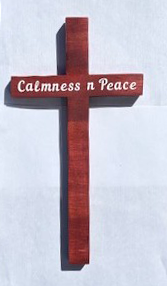 Rustic wooden cross with "Calmness and Peace" engraved, designed by Miguel Martinez, symbolizing tranquility and spiritual serenity.