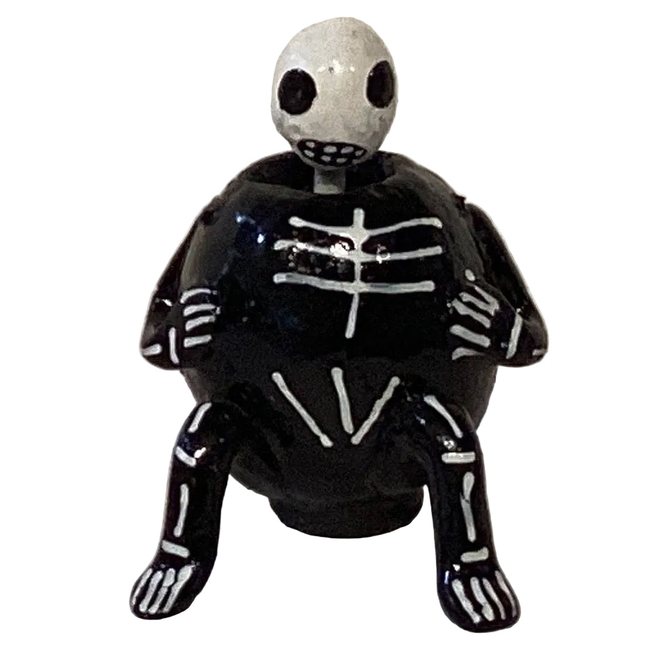 Skeleton Wobble Head figurine from Ysleta Mission Gift Shop, featuring a detailed skeleton with a wobbling head for home decor.