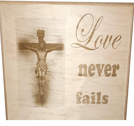 Plaque Love Never Fails Jesus on Cross Maple Wood Lasered Wall Art 12 X 12
