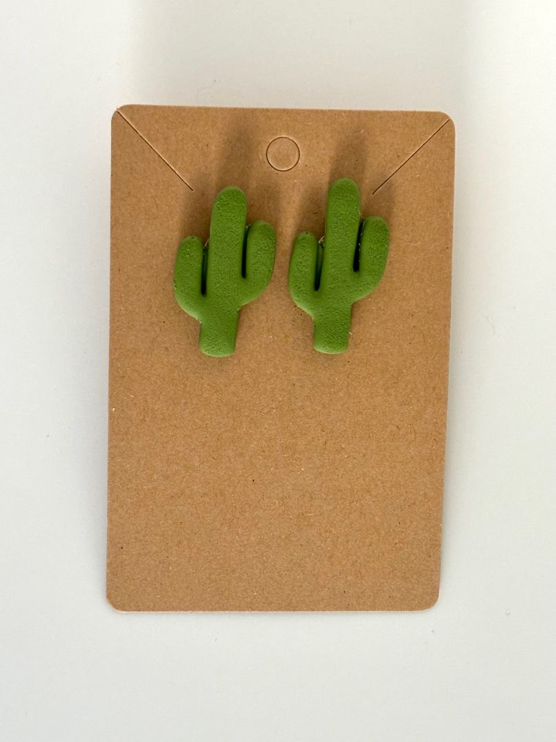 Polymer clay cactus stud earrings with stainless steel posts by Melissa Cortinas, 1.25 inches long and 0.75 inches wide.