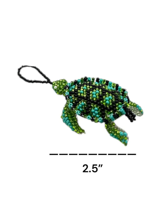 Handmade Mexican beaded turtle ornament with intricate seed bead design, crafted by Jose Alberto Chavez, ideal as a bag accessory.