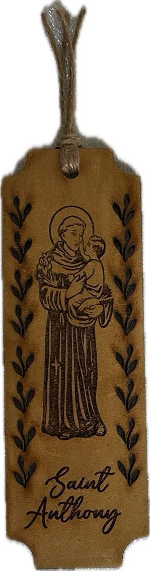 Assorted laser-cut wooden bookmarks featuring Catholic and Christian faith symbols, 6x2 inches, by Norma Cordova De Schaefer.