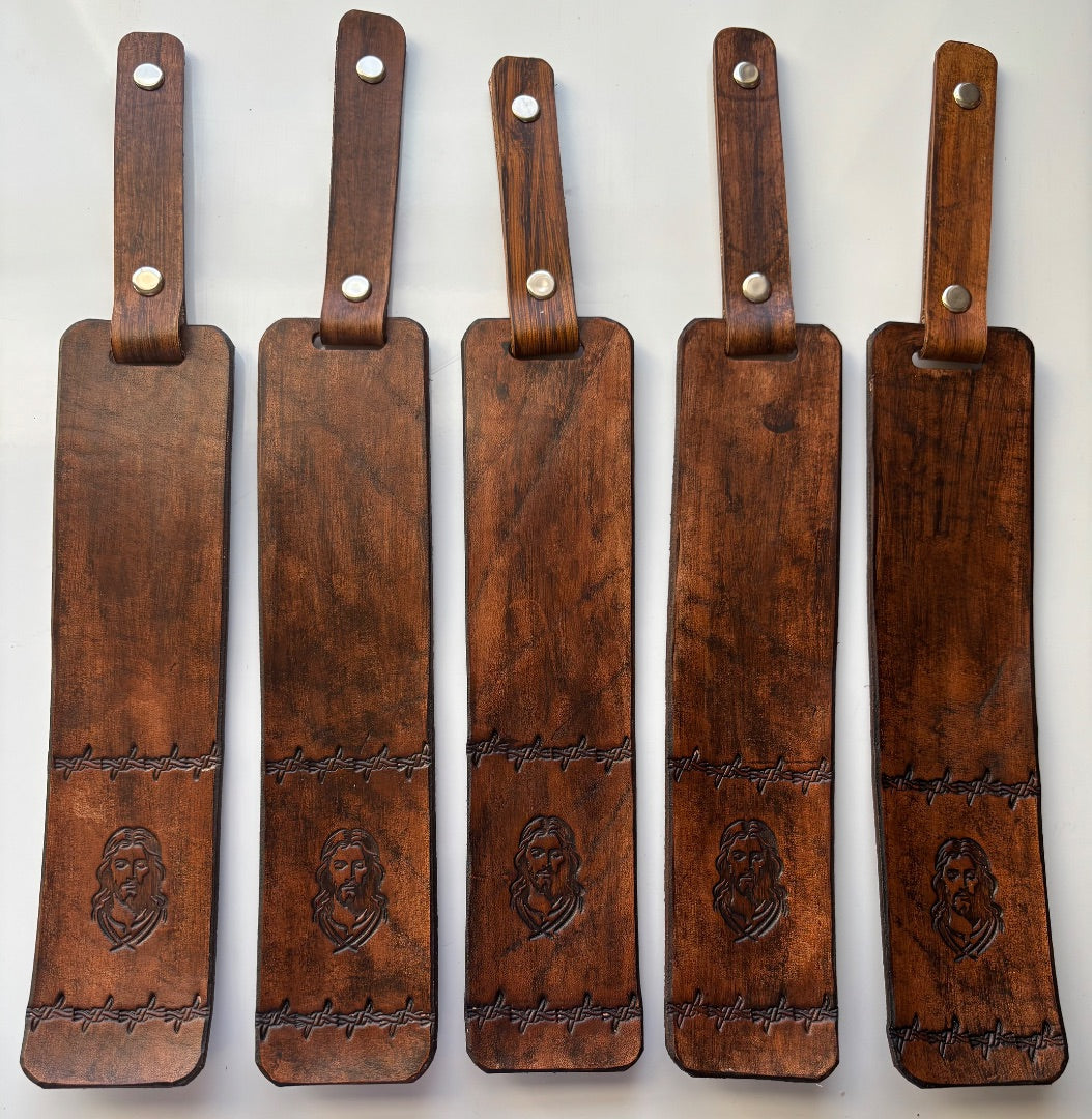 Brown Jesus leather bookmark by Consuelo Barraza featuring a detailed leather design for book accessories.