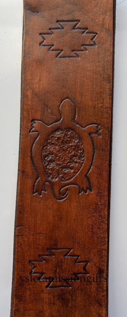 Brown Southwest leather bookmark by Consuelo Barraza featuring intricate leatherwork, designed for adding style to your books.