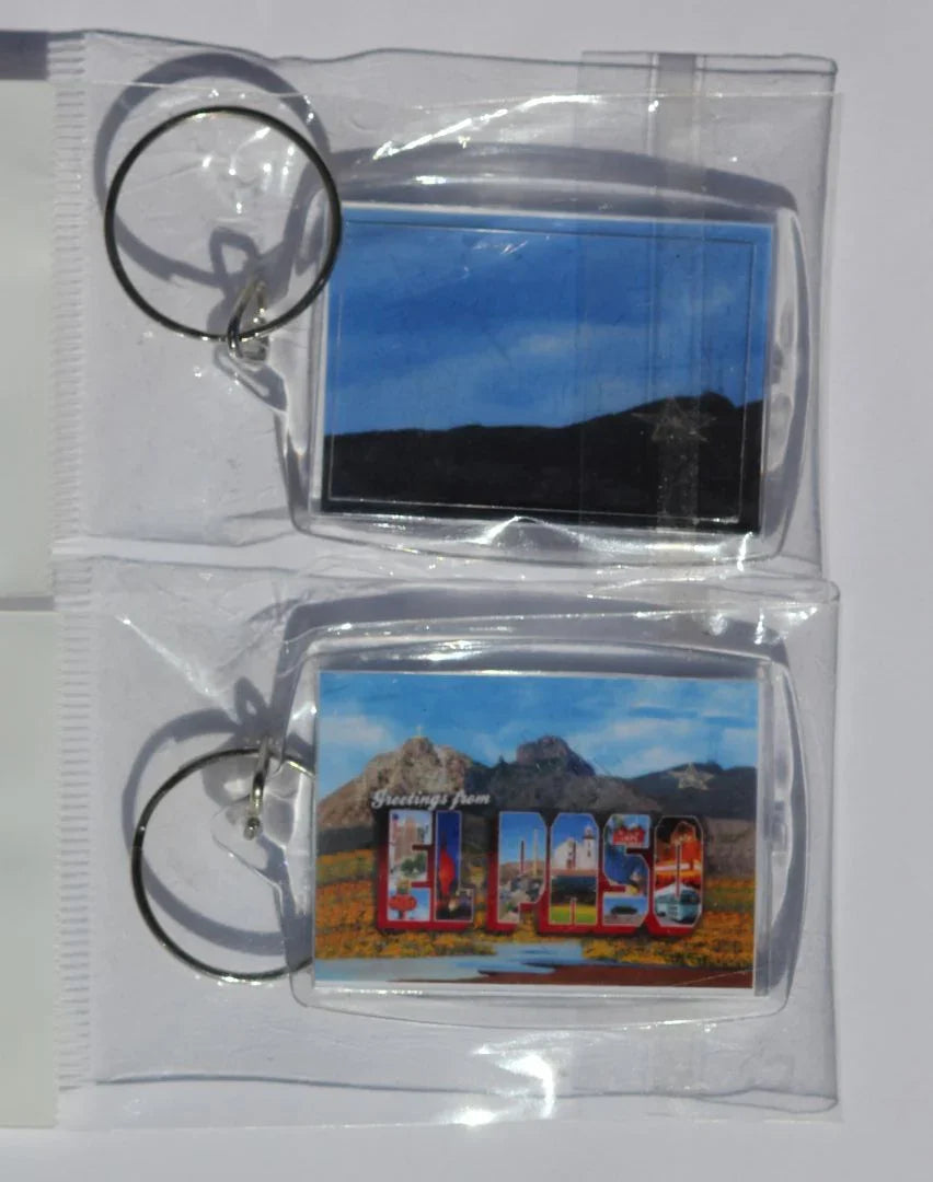 El Paso Mountain and Logo acrylic key chain by Miguel Martinez, double-sided with mountain and city logo design, 2 1/8" x 1 1/2".