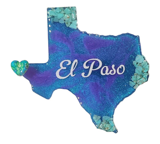 Assorted El Paso resin magnets featuring southwestern designs, souvenirs, and keepsakes by Brigitte Rosson displayed on a surface.