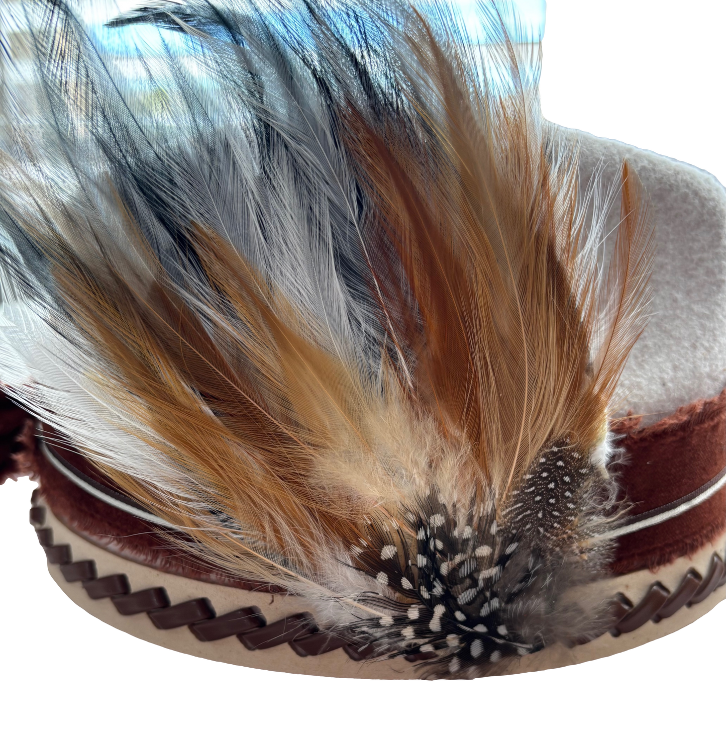 Feather hat clip by Consuelo Barraza, elegant accessory for hair or hats with soft feather details.