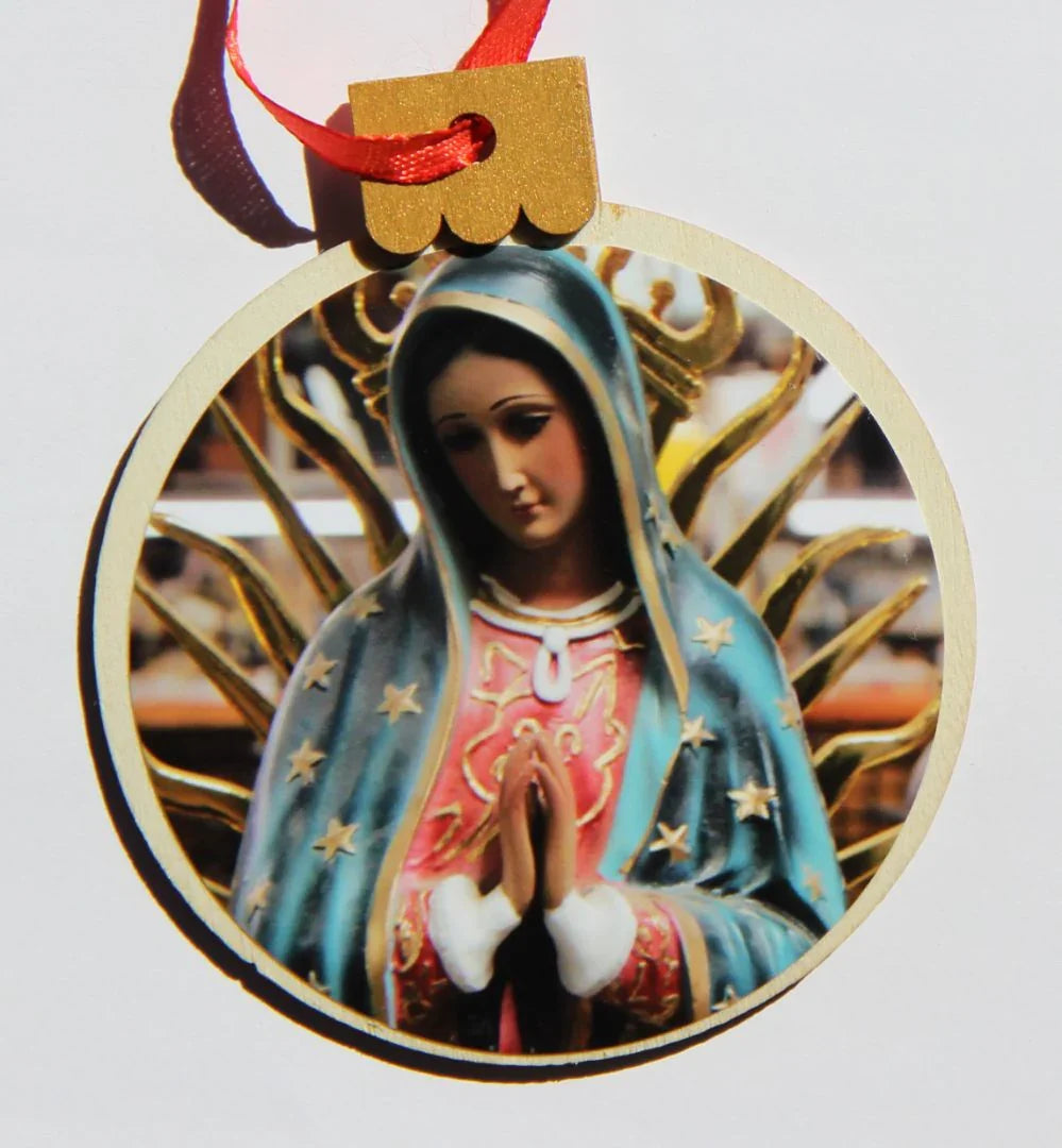 Blue Virgin-themed wooden Christmas ornament, round shape, 3.77 x 4.29 inches, by Miguel Martinez for holiday decoration.
