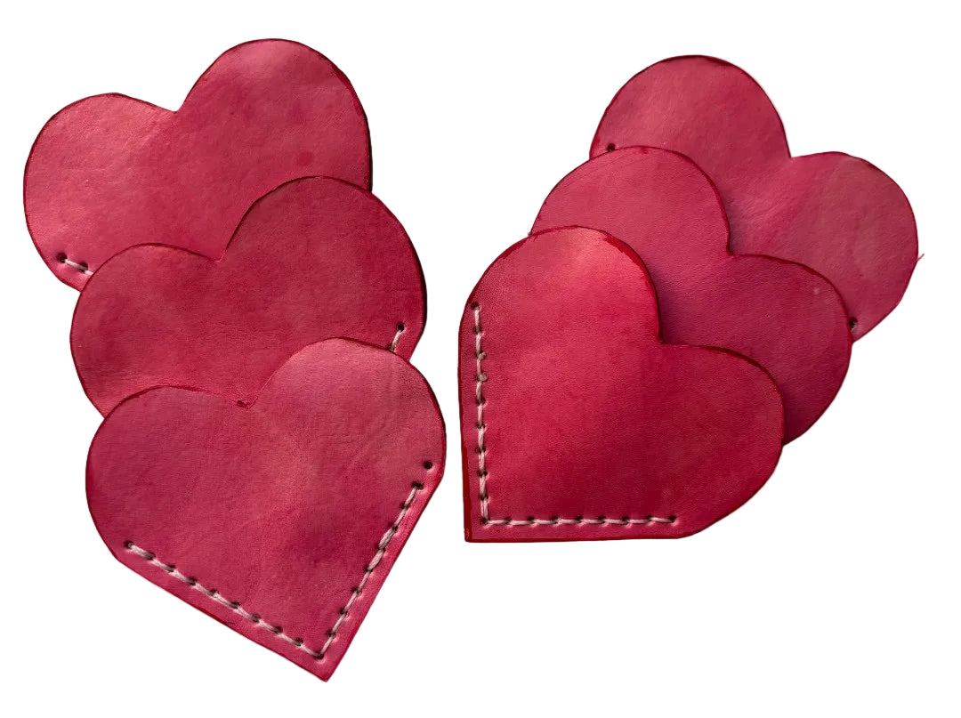 Pink heart-shaped bookmark by Consuelo Barraza, decorative home and garden book accessory with a charming design.