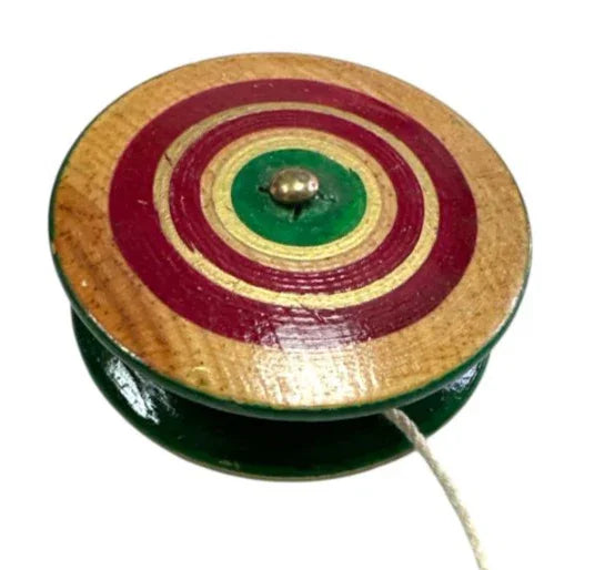 Hand-painted traditional wooden yoyo by Jose Alberto Chavez, Mexican spinner toy for home and garden play.