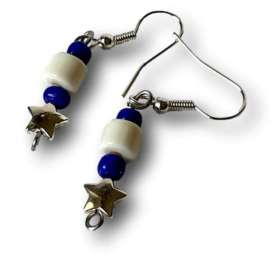 White acrylic cylinder bead earrings with blue seed beads, silver star charms, 1-inch dangle, by Sylvia Leroux.