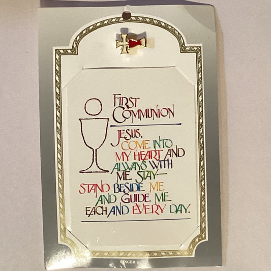 First Communion & Confirmation prayer card with Catholic lapel pin featuring religious symbols and Christian devotional accessories.