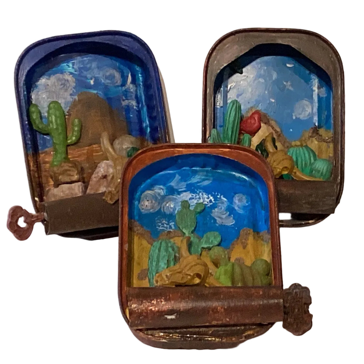 Western ambiance tin terrarium with desert-themed decor and cacti, crafted by Ysleta Mission Gift Shop.