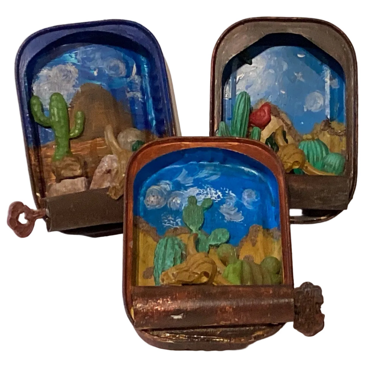 Western-themed tin terrarium with desert plants and decorative accents, designed for rustic ambiance by Ysleta Mission Gift Shop.