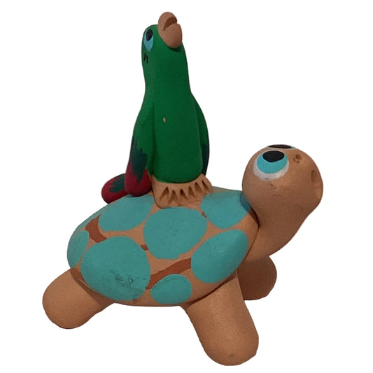 Clay figurine of a parrot perched on a turtle, 4 inches tall, handmade home and garden decorative figurine by Ysleta Mission Gift Shop