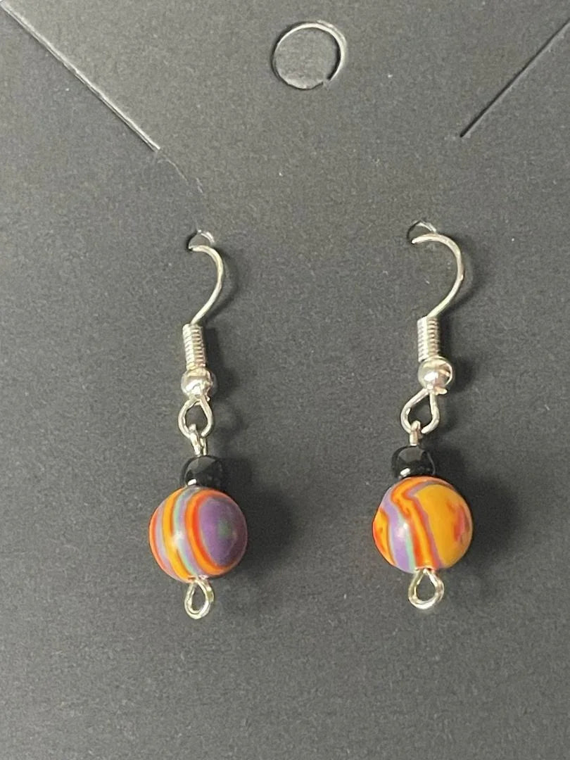 Rainbow Calsilica and black seed bead dangle earrings by Sylvia Leroux featuring vibrant gemstone and bead details.