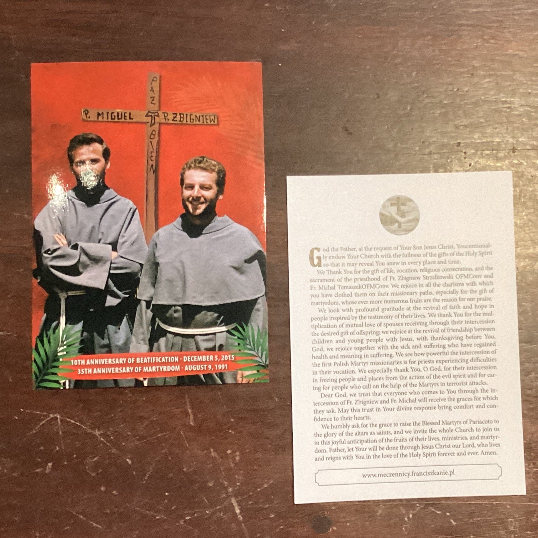 Catholic faith booklet set by Father Jarek commemorating Beatification and Martyrdom anniversaries, featuring religious cards and images.