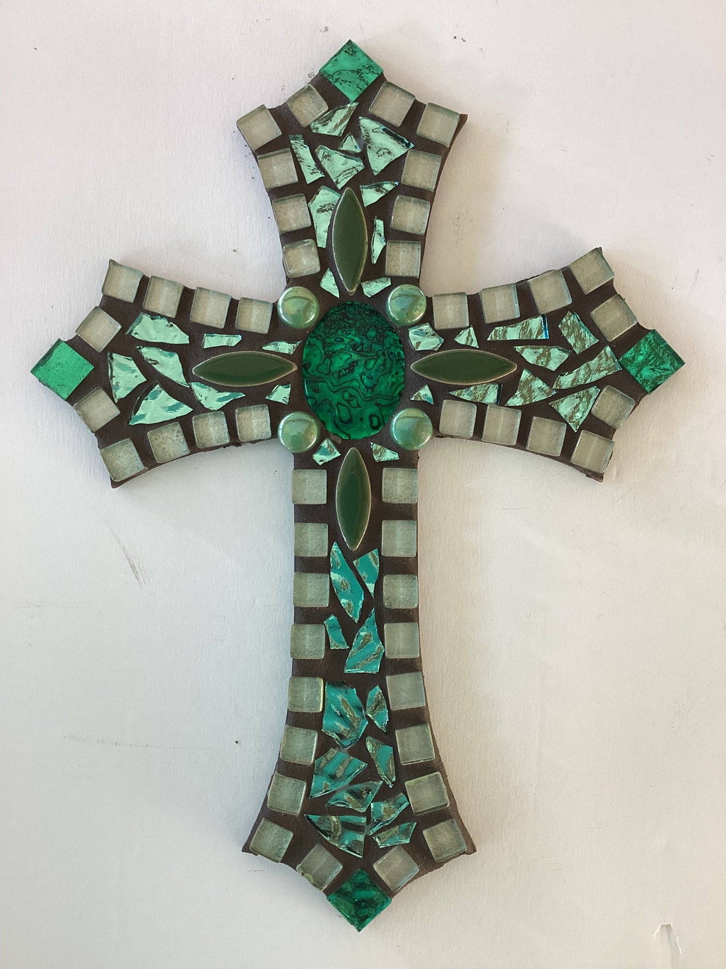 10x7 mosaic cross on wood in greens with mother of pearl center - Ysleta Mission Gift Shop