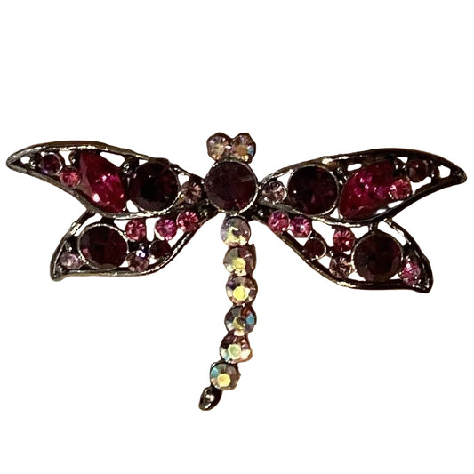 Pink gemstone dragonfly brooch with intricate details, Catholic Christian jewelry, symbol of faith and beauty.