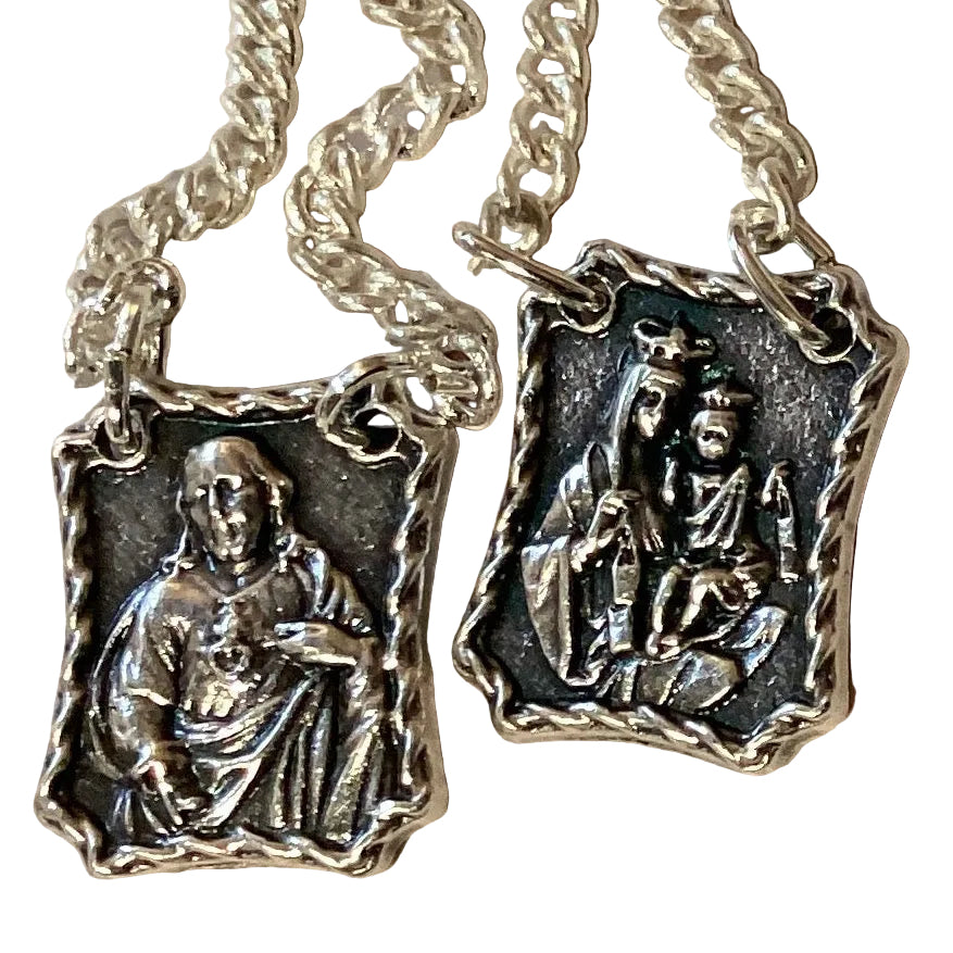 Silver metal Sacred Heart and Mount Carmel Catholic scapular with religious imagery, made in Italy, 1 inch in size.
