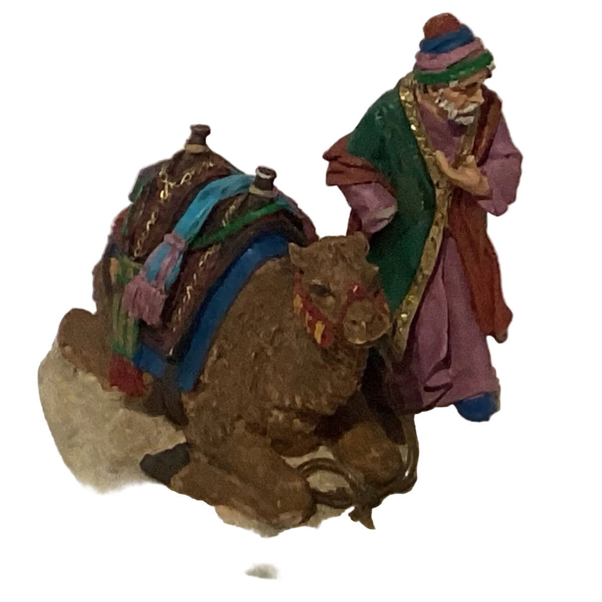Ceramic Christmas figurines in assorted styles, seasonal holiday decor by Ysleta Mission Gift Shop, featuring festive holiday characters.