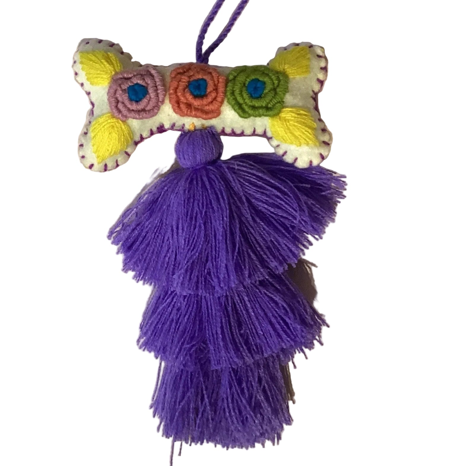 Handcrafted Mexican embroidered dog bone charm tassel accessory with colorful embroidery and leather details, by Jose Alberto Chavez.