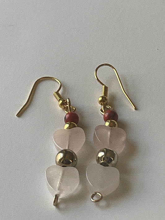 Red stone and rose quartz heart dangle earrings by Sylvia Leroux featuring 2-inch gold hooks and beaded design.