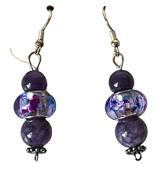 2-inch dangle earrings featuring amethyst beads with silver flower bead caps, designed by Sylvia Leroux.