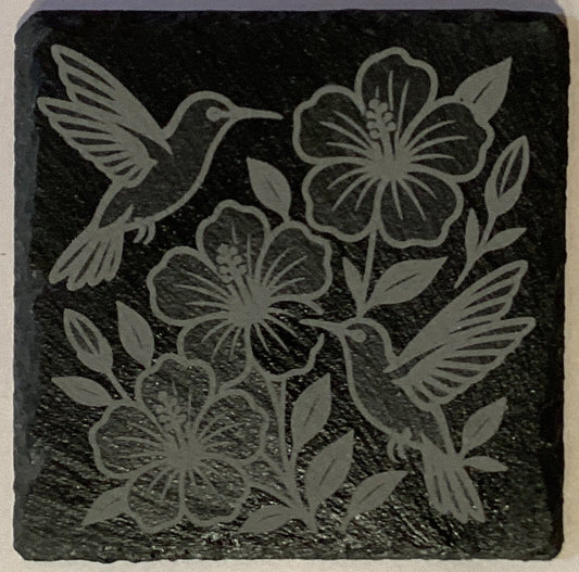 Set of four etched slate coasters with assorted designs, 4x4 inches, featuring natural stone texture and decorative patterns.