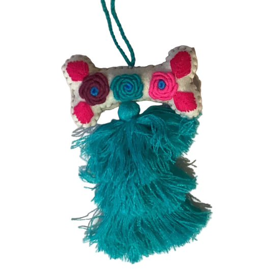Handcrafted Mexican embroidered dog bone charm with tassel, artisan accessory from Jose Alberto Chavez, ideal for bag decoration.