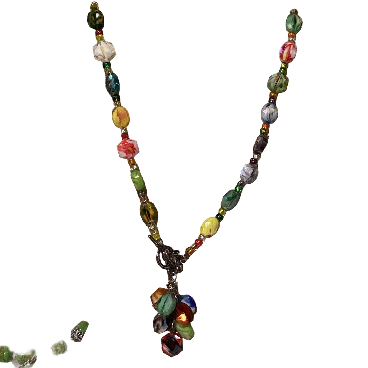 Multicolor beaded front-closure necklace from Ysleta Mission Gift Shop, 14 inches, with vibrant beaded design and clasp detail.