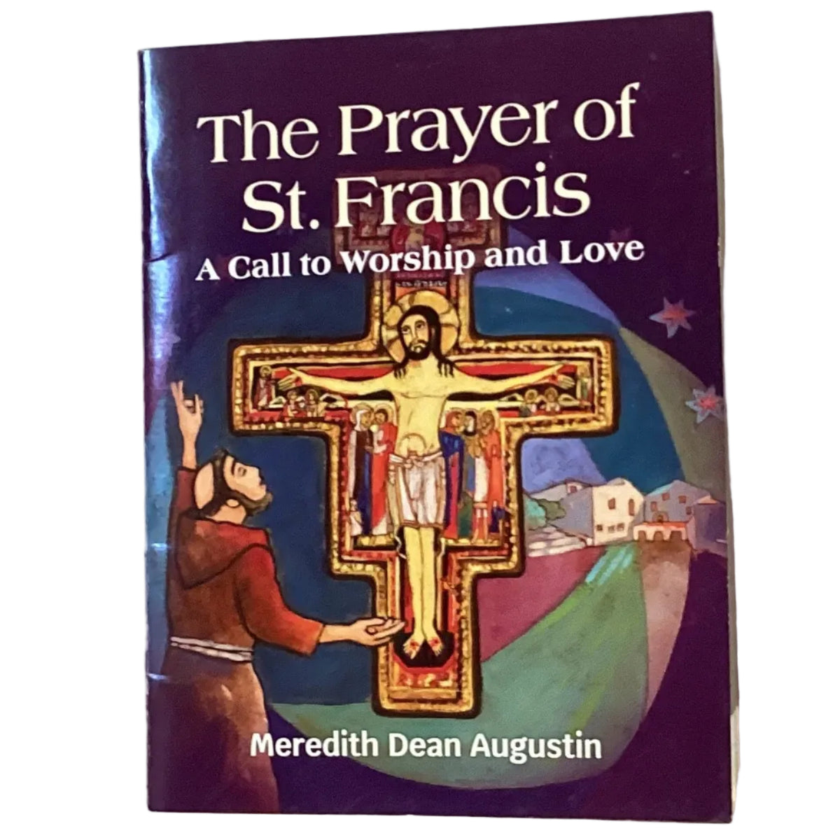 Open copy of The Prayer of Saint Francis Catholic devotion book with elegant cover design and religious text inside.