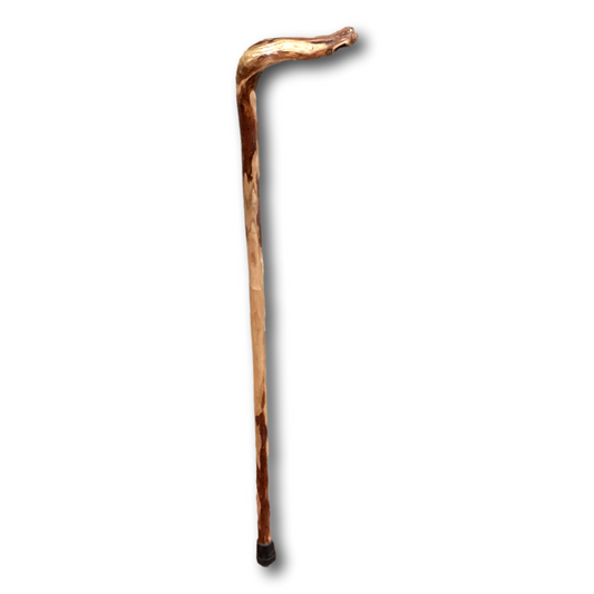 Hand-carved New Mexico walking stick cane from Ysleta Mission Gift Shop, featuring intricate designs and a natural wood finish.