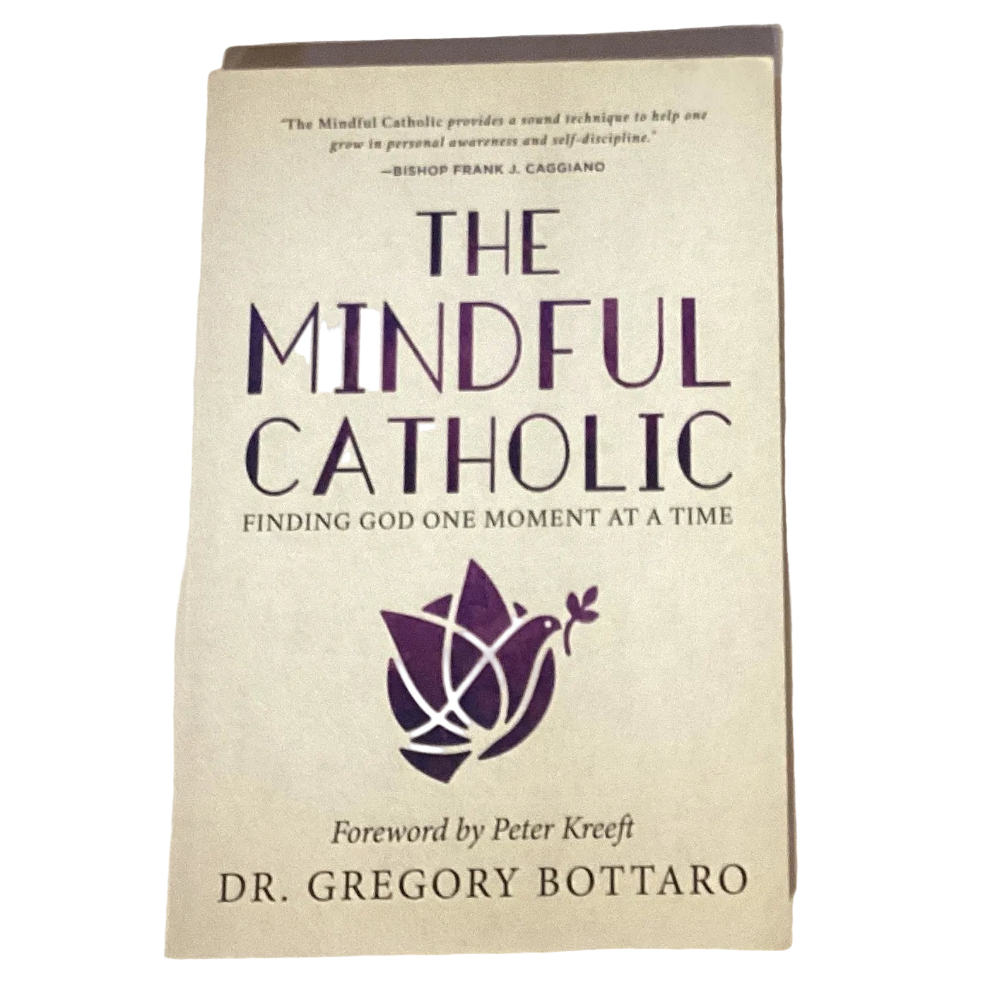 Open book titled "The Mindful Catholic: Finding God One Moment at a Time," Catholic faith and devotion book by Ysleta Mission Gift Shop.