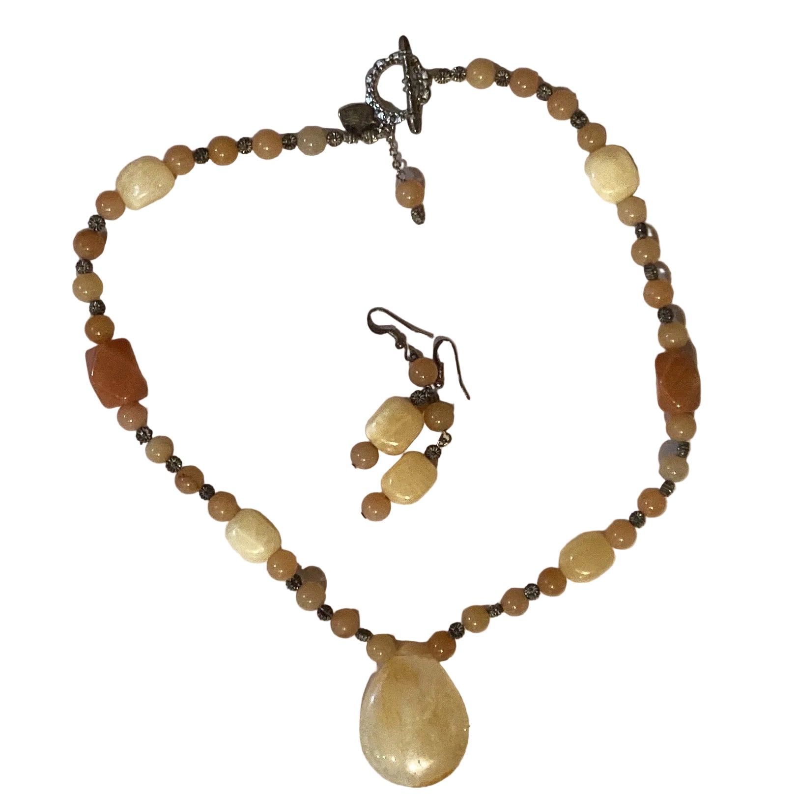 Handmade beaded jewelry set with matching necklace and earrings, featuring colorful beads and intricate craftsmanship.
