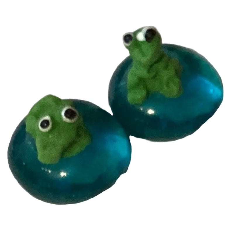 Handmade frog figurine measuring 0.75 inches, crafted for home and garden decor by Ysleta Mission Gift Shop.