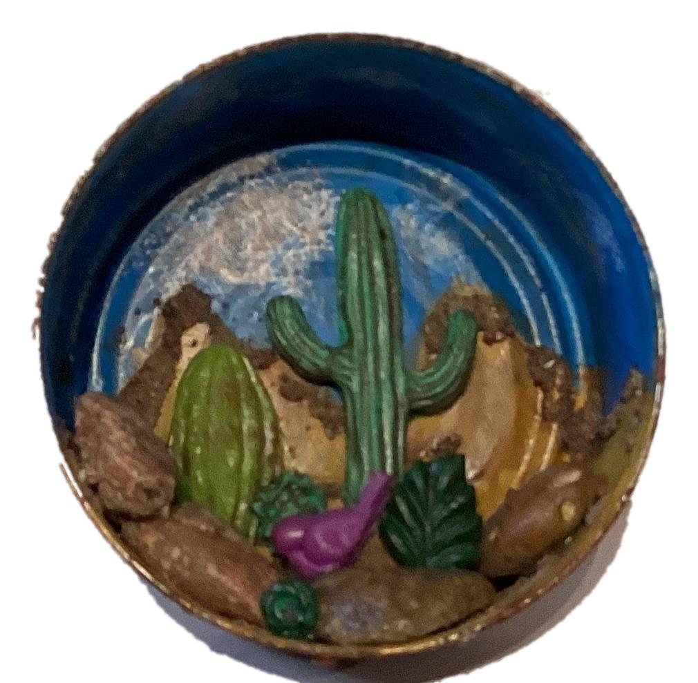 Western-themed tin terrarium with desert scene, featuring cacti and rustic accents from Ysleta Mission Gift Shop.