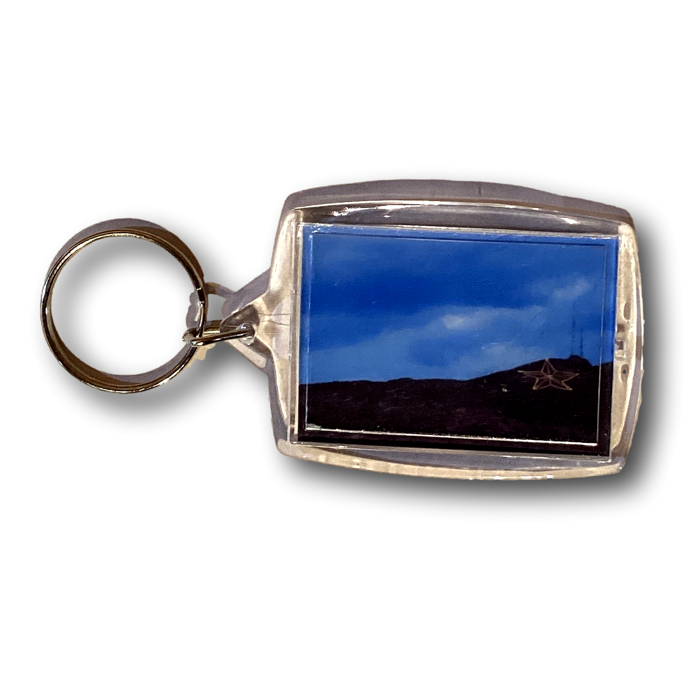 Greetings from El Paso postcard keychain featuring a star on a mountain under a blue night sky, by Ysleta Mission Gift Shop.
