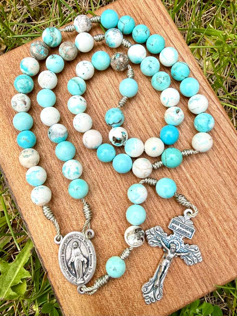 Blue and white jasper Catholic rosary with Miraculous Medal centerpiece and pardon crucifix, five-decade Christian prayer beads.