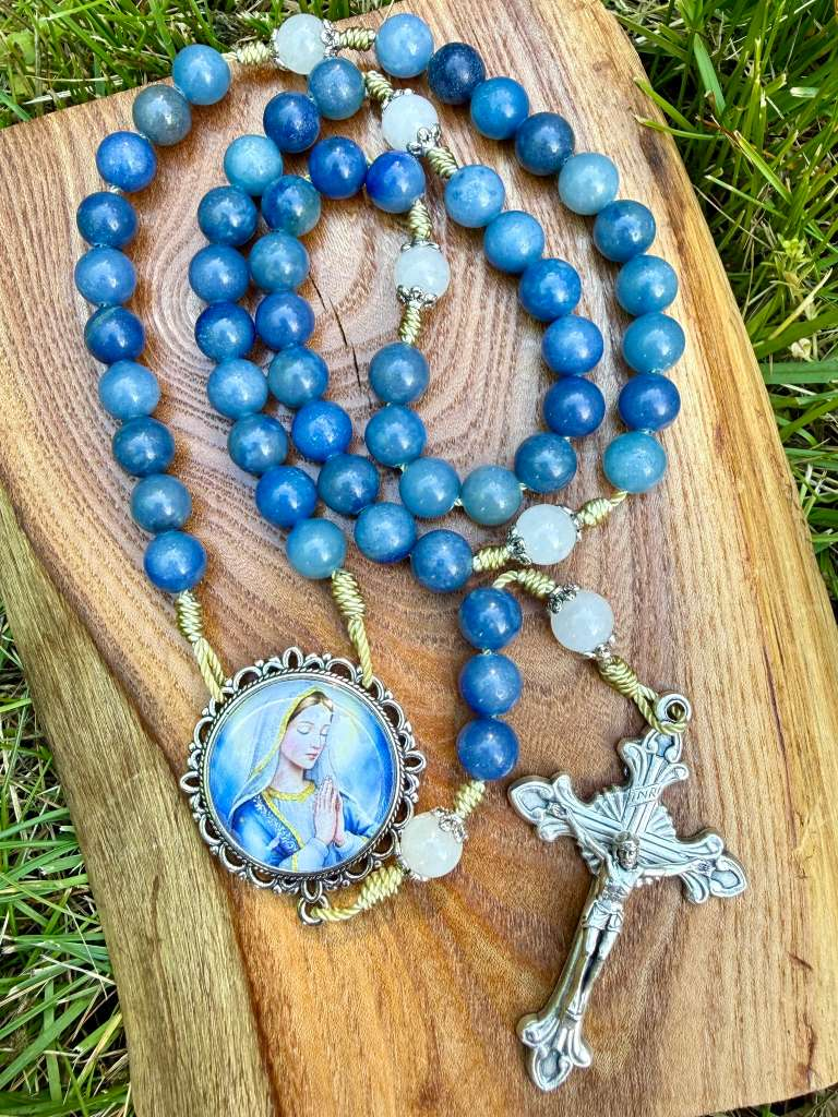Aventurine and jade Marian Catholic rosary with ornate five-decade design, featuring a Marian centerpiece and crucifix.