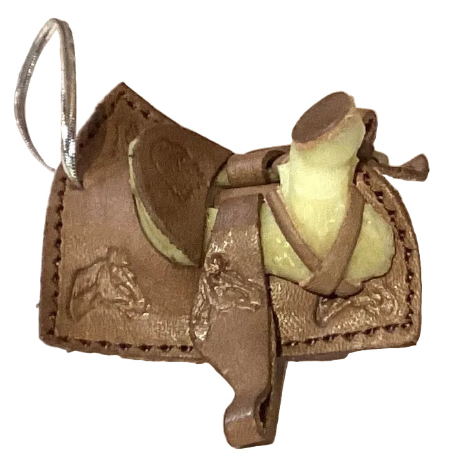 Mini leather saddle keychain with Western cowboy design, perfect as a gift, featuring detailed stitching and rustic brown leather.